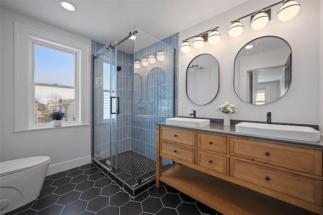 141 Blackhawk St, Squirrel Hill, PA 15218 - bathroom with double vanity, a shower stall, and tile patterned flooring
