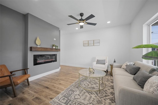 141 Blackhawk St, Squirrel Hill, PA 15218 - living room featuring wood finished floors, recessed lighting, ceiling fan, and a glass covered fireplace