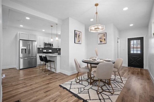 141 Blackhawk St, Squirrel Hill, PA 15218 - dining room featuring wood finished floors, recessed lighting, and a chandelier