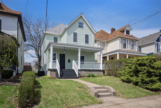 141 Blackhawk St, Squirrel Hill, PA 15218 - view of front of house with a porch and a front lawn