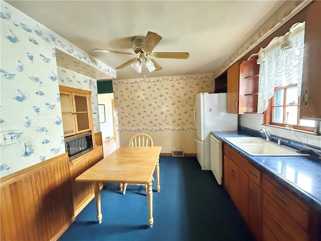 514 E Hazelcroft Ave, New Castle/2Nd, PA 16105 - kitchen featuring wallpapered walls, white appliances, ceiling fan, and brown cabinetry