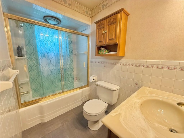 514 E Hazelcroft Ave, New Castle/2Nd, PA 16105 - bathroom featuring tile walls, enclosed tub / shower combo, a wainscoted wall, and vanity