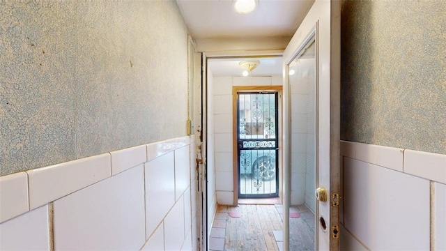 237 Wick St, Hill District, PA 15219 - doorway with light wood-style floors and a wainscoted wall