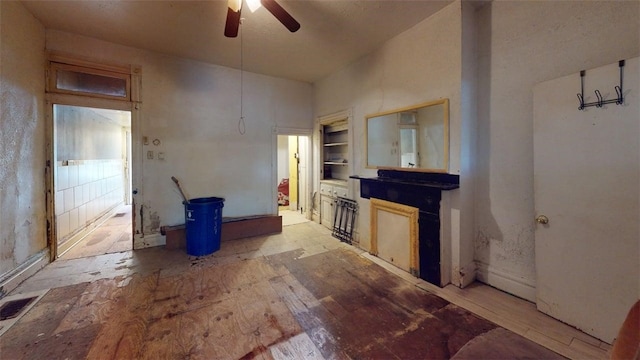 237 Wick St, Hill District, PA 15219 - unfurnished living room with ceiling fan, built in features, and light wood finished floors