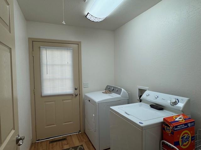 436 Lloyd Ave, Latrobe, PA 15650 - laundry room featuring independent washer and dryer, light wood finished floors, and attic access