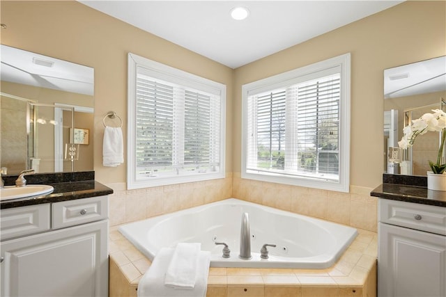 8010 Sherwood Dr, Collier Twp, PA 15142 - full bath featuring two vanities, a stall shower, and a jetted tub
