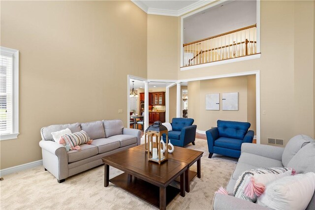 8010 Sherwood Dr, Collier Twp, PA 15142 - carpeted living room featuring ornamental molding and a towering ceiling