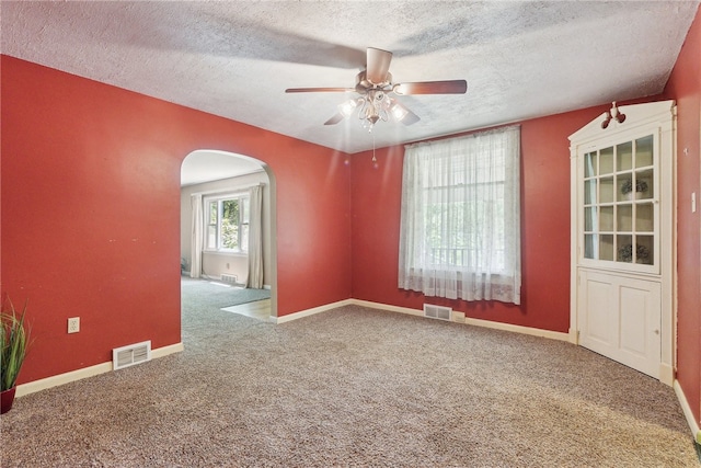 222 Lear Rd, Blairsville Area, PA 15717 - unfurnished room with a textured ceiling, arched walkways, carpet, and a ceiling fan