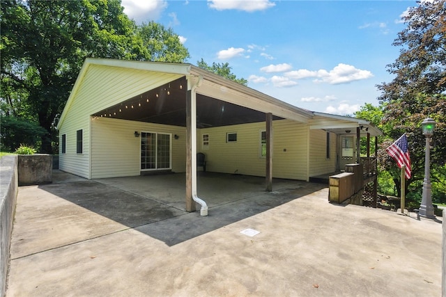 222 Lear Rd, Blairsville Area, PA 15717 - rear view of house with concrete driveway and an attached carport