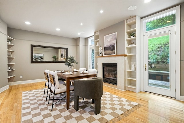 140 N Woodland Rd, Shadyside, PA 15232 - dining space with a tiled fireplace, light wood-style floors, recessed lighting, and built in features