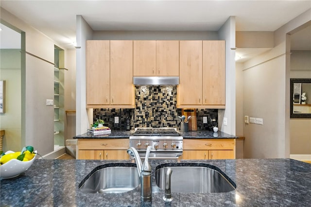 140 N Woodland Rd, Shadyside, PA 15232 - kitchen with under cabinet range hood, stainless steel stove, dark stone counters, and light brown cabinets