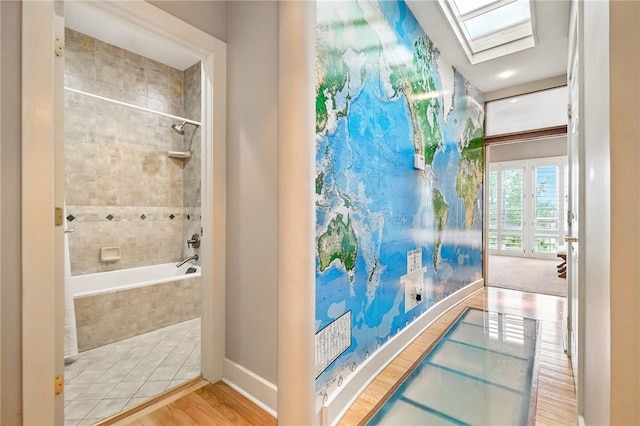 140 N Woodland Rd, Shadyside, PA 15232 - bathroom featuring a skylight and wood finished floors