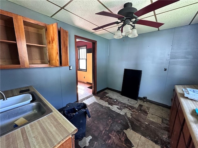 302 Franklin Ave, Applewold, PA 16201 - kitchen with brown cabinetry, ceiling fan, and a paneled ceiling
