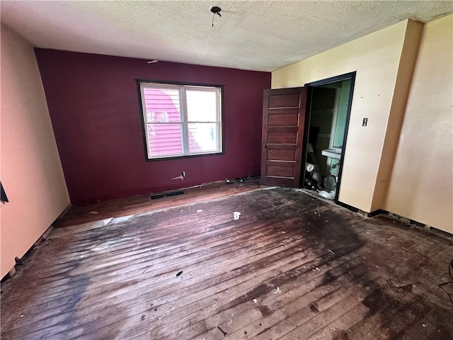 302 Franklin Ave, Applewold, PA 16201 - spare room featuring a textured ceiling and hardwood / wood-style flooring
