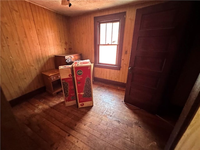 302 Franklin Ave, Applewold, PA 16201 - home office with hardwood / wood-style flooring, a textured ceiling, and wood walls