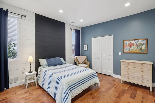 3130 Dobson St, Polish Hill, PA 15219 - bedroom with wood finished floors, recessed lighting, a closet, and an accent wall