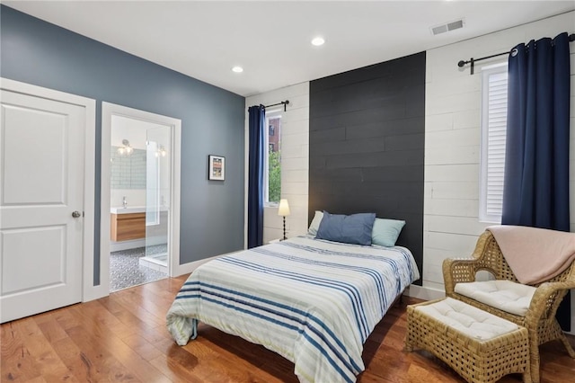 3130 Dobson St, Polish Hill, PA 15219 - bedroom featuring light wood-type flooring, multiple windows, recessed lighting, and connected bathroom