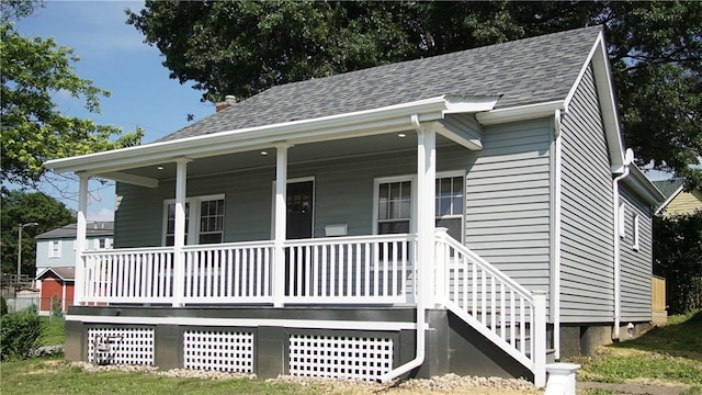 801 9th Ave, Brackenridge, PA 15014 - view of front of house featuring a porch and roof with shingles