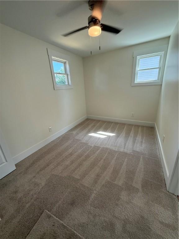 801 9th Ave, Brackenridge, PA 15014 - empty room with light colored carpet and a ceiling fan