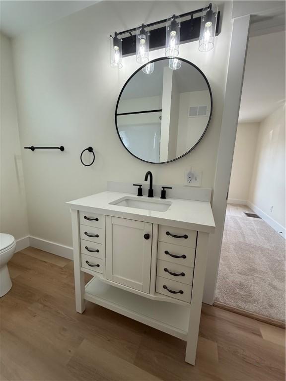 801 9th Ave, Brackenridge, PA 15014 - bathroom featuring vanity and wood finished floors
