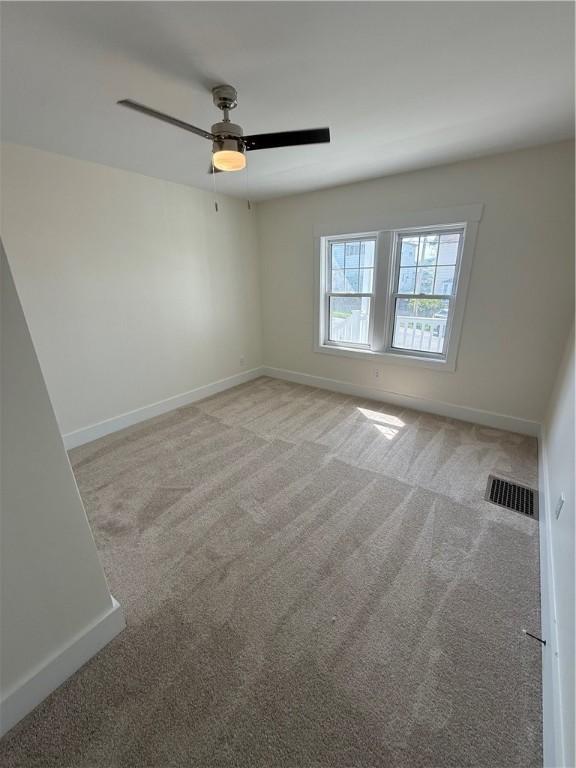 801 9th Ave, Brackenridge, PA 15014 - empty room with light colored carpet and ceiling fan