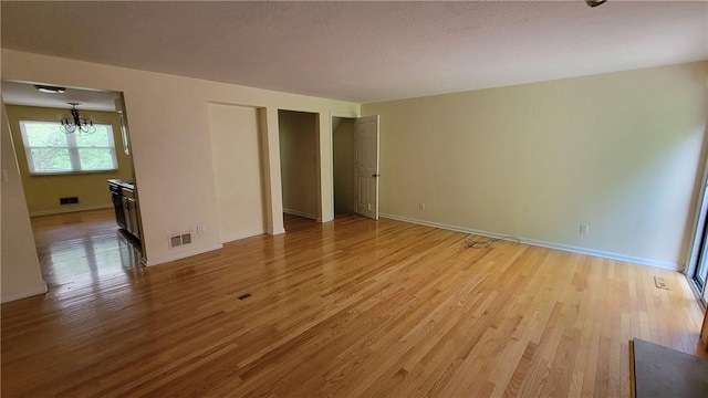 402 Forest Ridge Dr, Forest Hills Boro, PA 15221 - unfurnished bedroom with light wood-style flooring and a chandelier