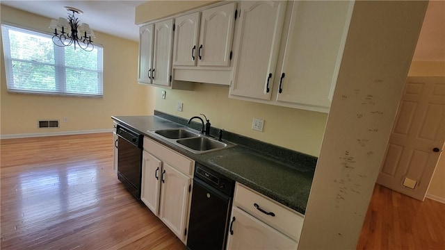 402 Forest Ridge Dr, Forest Hills Boro, PA 15221 - kitchen featuring dishwasher, dark countertops, light wood-style flooring, white cabinetry, and a chandelier