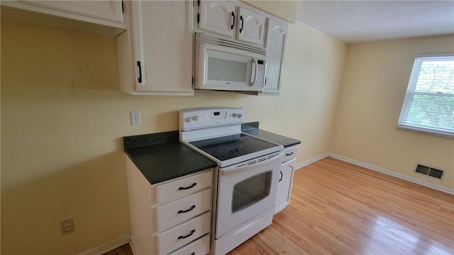 402 Forest Ridge Dr, Forest Hills Boro, PA 15221 - kitchen with white appliances, dark countertops, light wood-style floors, and white cabinets