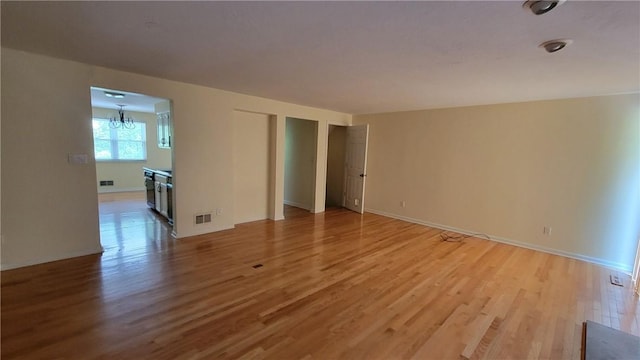 402 Forest Ridge Dr, Forest Hills Boro, PA 15221 - empty room with a chandelier and light wood finished floors