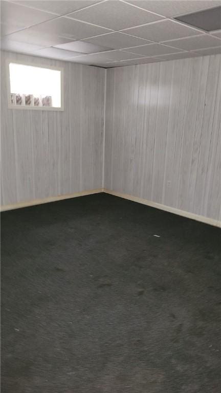 402 Forest Ridge Dr, Forest Hills Boro, PA 15221 - empty room featuring a drop ceiling, carpet, and wood walls