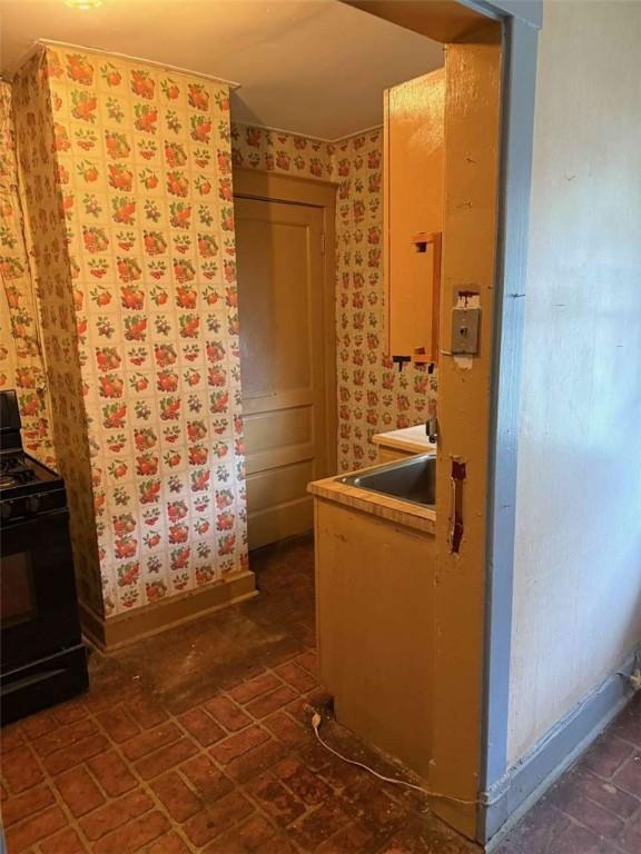 25-27 Joel St, Ingram, PA 15205 - bathroom with wallpapered walls and brick patterned floors