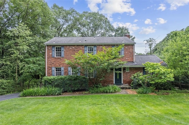 195 Grandview Dr N, Fox Chapel, PA 15215 - view of front facade with a chimney, a front lawn, and brick siding