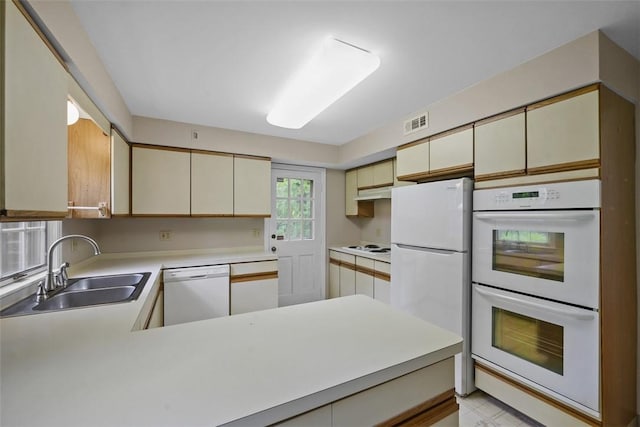 195 Grandview Dr N, Fox Chapel, PA 15215 - kitchen with white appliances, cream cabinets, light countertops, and a peninsula