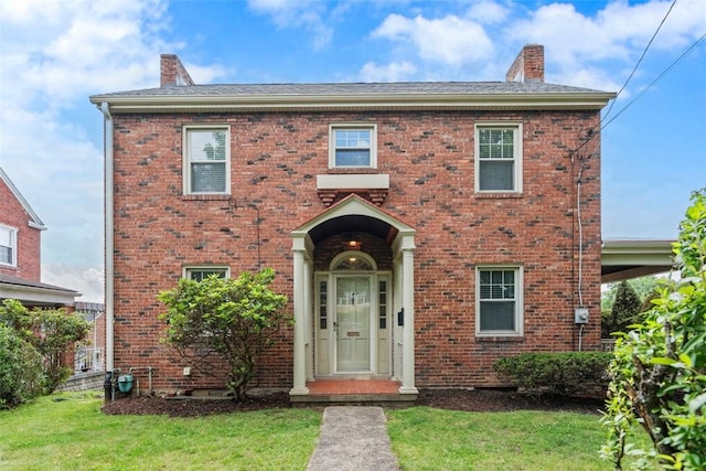 148 Stanton Ct E, Stanton Heights, PA 15201 - colonial inspired home featuring a chimney, brick siding, and a front yard