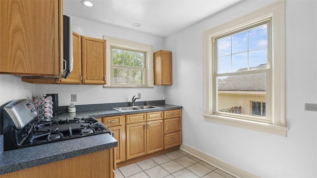 148 Stanton Ct E, Stanton Heights, PA 15201 - kitchen with stove, dark countertops, light tile patterned floors, brown cabinets, and recessed lighting
