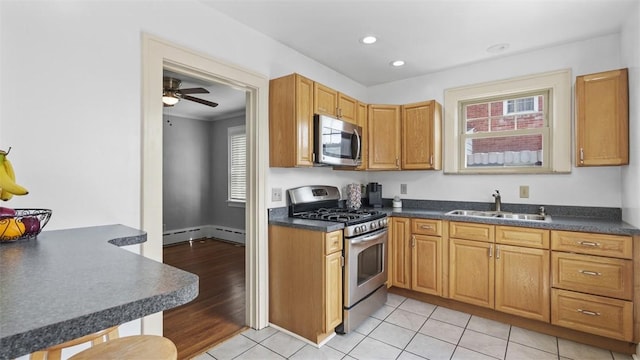 148 Stanton Ct E, Stanton Heights, PA 15201 - kitchen featuring stainless steel appliances, dark countertops, recessed lighting, a ceiling fan, and light tile patterned floors