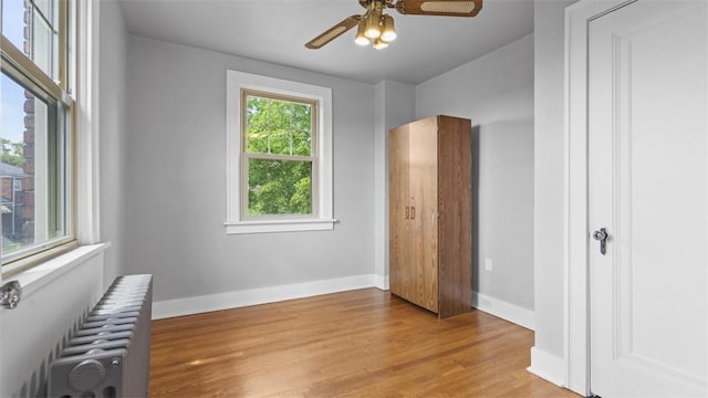 148 Stanton Ct E, Stanton Heights, PA 15201 - unfurnished bedroom featuring radiator heating unit, wood finished floors, and ceiling fan