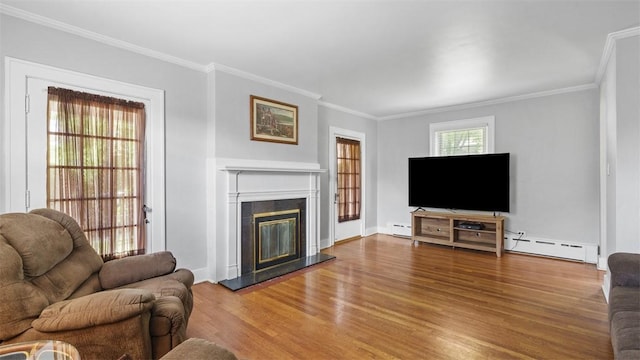 148 Stanton Ct E, Stanton Heights, PA 15201 - living area with wood finished floors, crown molding, baseboard heating, and a glass covered fireplace