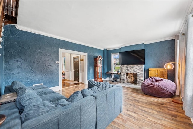 528 Spring St, Latrobe, PA 15650 - living room with crown molding, wood finished floors, a fireplace, and wallpapered walls