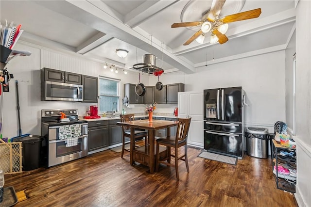 528 Spring St, Latrobe, PA 15650 - kitchen featuring stainless steel appliances, ceiling fan, dark wood finished floors, beamed ceiling, and coffered ceiling