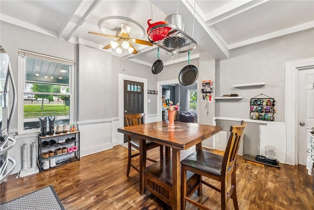 528 Spring St, Latrobe, PA 15650 - dining area featuring a ceiling fan, wood finished floors, beam ceiling, and a wainscoted wall