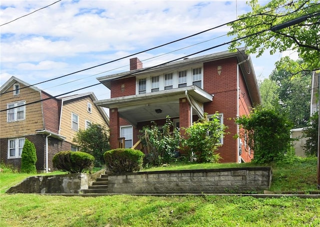 349 Avenue E Ave E, Forest Hills Boro, PA 15221 - view of front facade with brick siding, a chimney, a front lawn, and a porch
