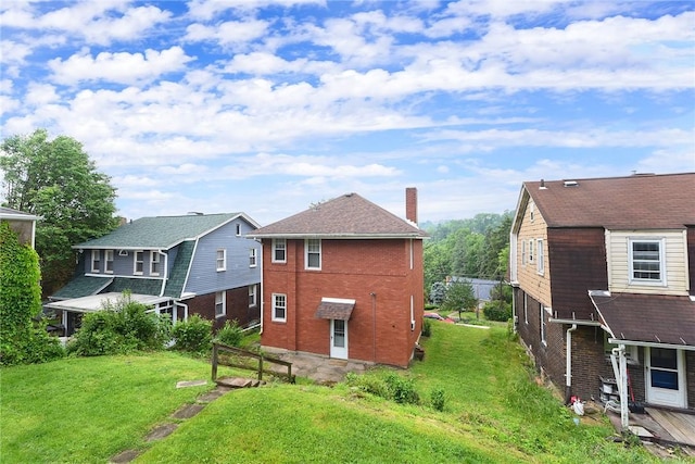 349 Avenue E Ave E, Forest Hills Boro, PA 15221 - back of house with a yard and brick siding