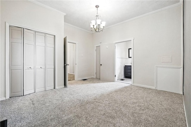 39 Danvers Ave, Ingram, PA 15205 - unfurnished bedroom featuring a chandelier, carpet, ornamental molding, a closet, and ensuite bathroom