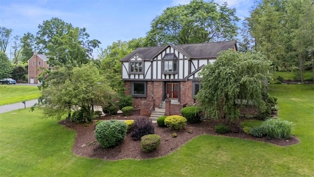 2616 Cedarvue Dr, Upper St Clair, PA 15241 - tudor home with a front yard and brick siding
