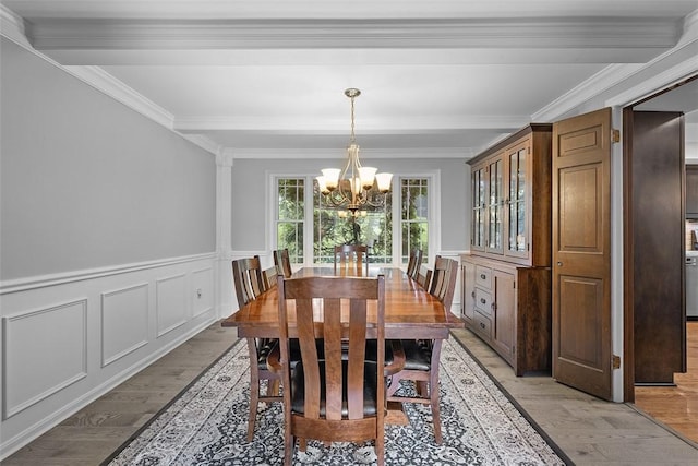 2616 Cedarvue Dr, Upper St Clair, PA 15241 - dining area with a chandelier, light wood finished floors, ornamental molding, a wainscoted wall, and beamed ceiling