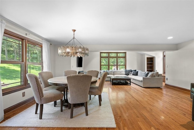 2616 Cedarvue Dr, Upper St Clair, PA 15241 - dining area with a chandelier, healthy amount of natural light, and light wood-style flooring