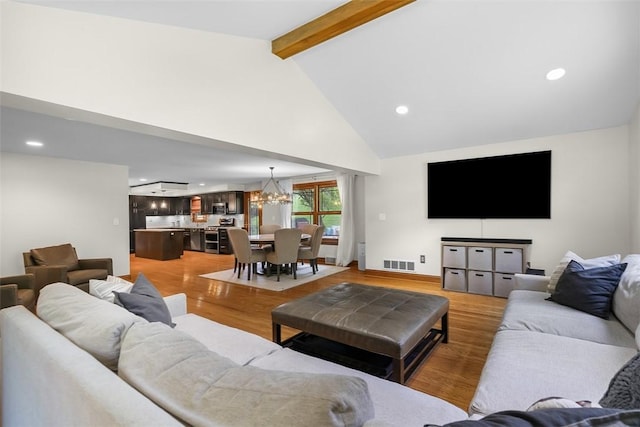 2616 Cedarvue Dr, Upper St Clair, PA 15241 - living room featuring a chandelier, beamed ceiling, light wood-style flooring, recessed lighting, and high vaulted ceiling
