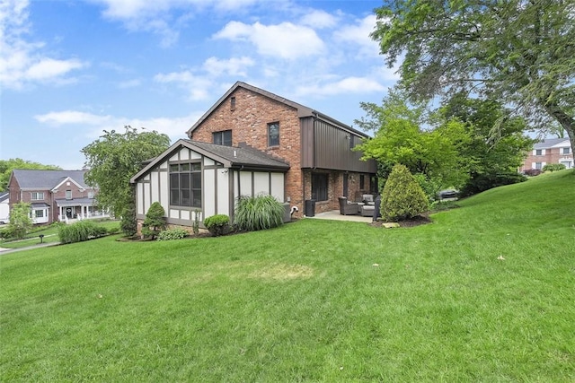2616 Cedarvue Dr, Upper St Clair, PA 15241 - back of house with brick siding, a lawn, and an outdoor living space