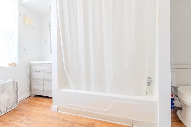 5801 Lincoln Ave, Export, PA 15632 - full bathroom featuring shower / bath combo and wood finished floors
